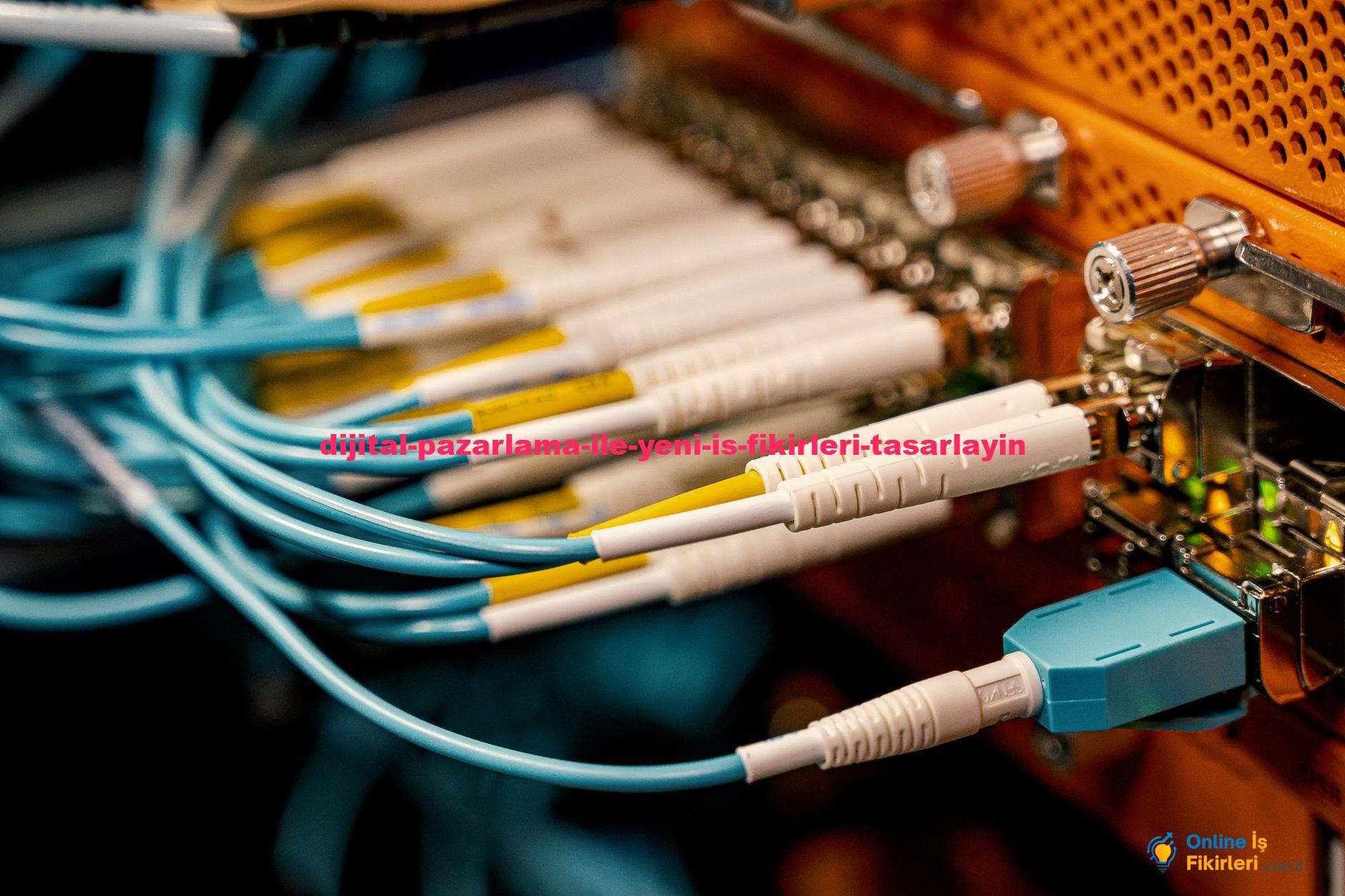 From above of optical switch equipment with many similar connectors with rubber cables and metal parts