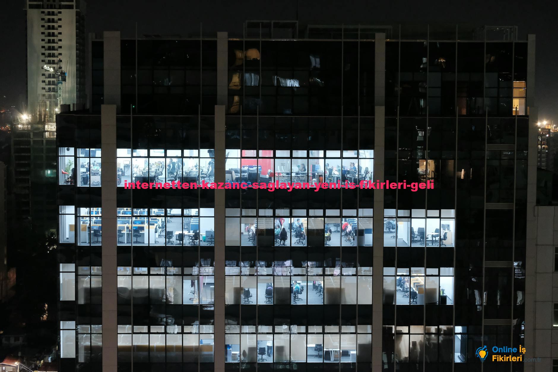 A night view of an office building in Central Visayas, Philippines, showcasing illuminated office windows.