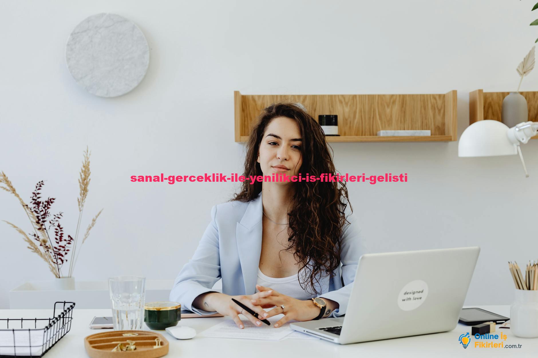 Businesswoman in a light blazer sitting at a desk with a laptop, exuding confidence in a modern office.