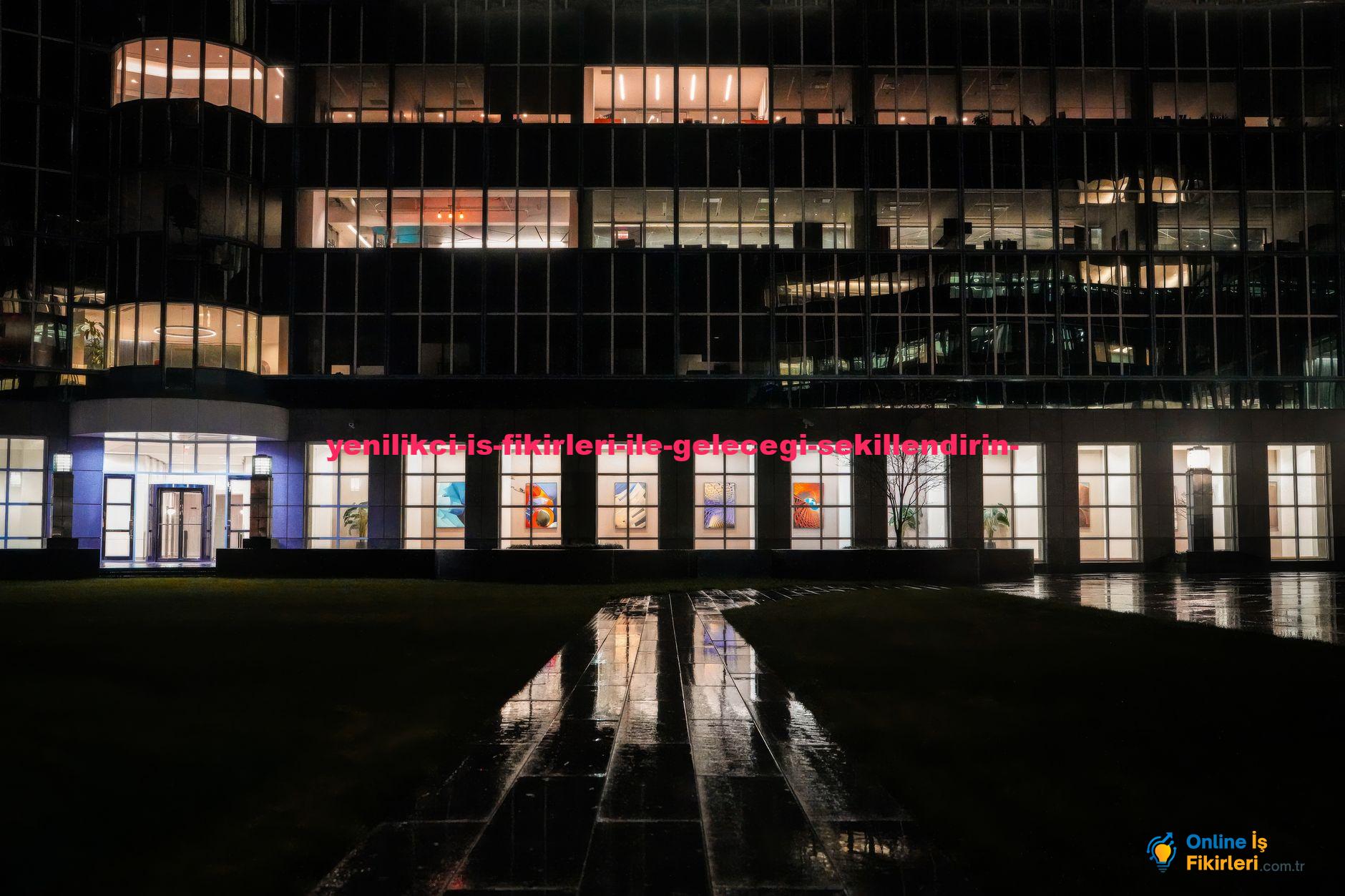 Illuminated office building exterior with reflections on wet pavement at night.