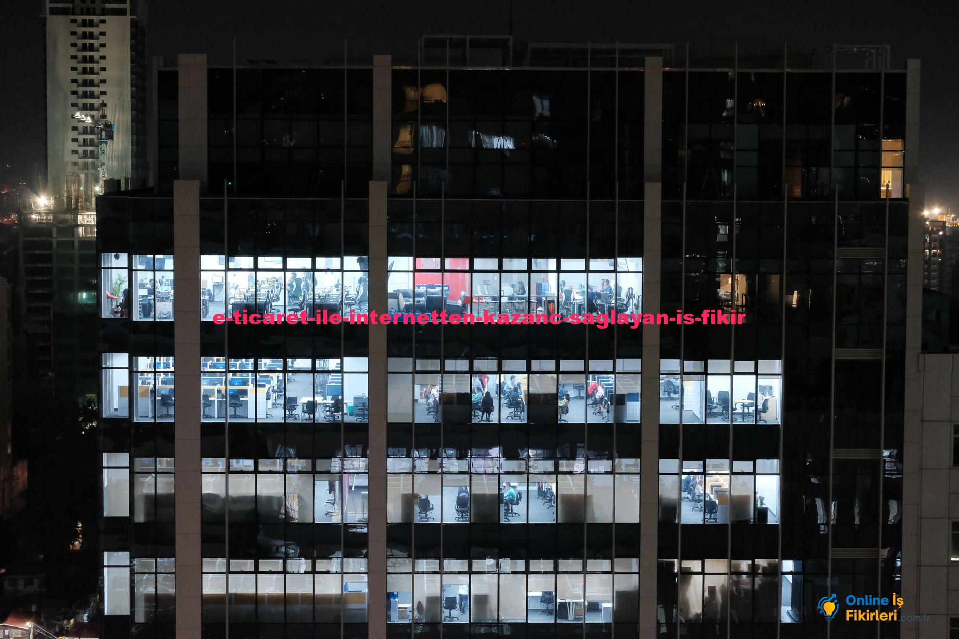 A night view of an office building in Central Visayas, Philippines, showcasing illuminated office windows.