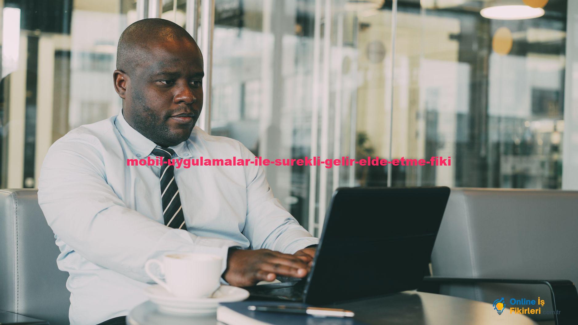 Businessman in cafe working on laptop with cup of coffee.